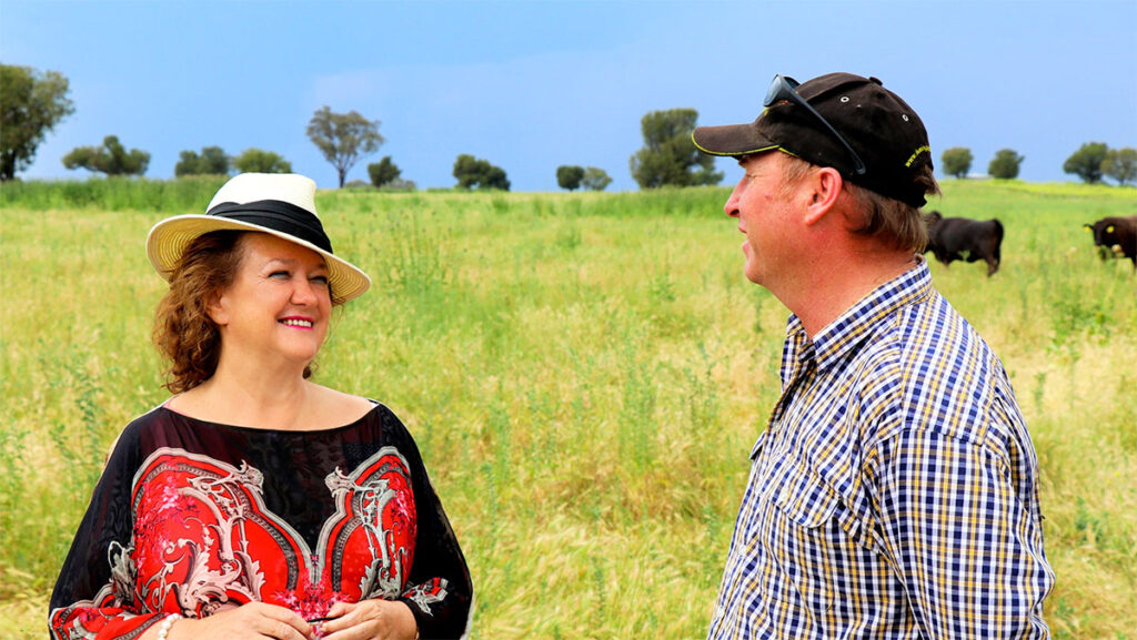 Gina Rinehart talking with farmer.