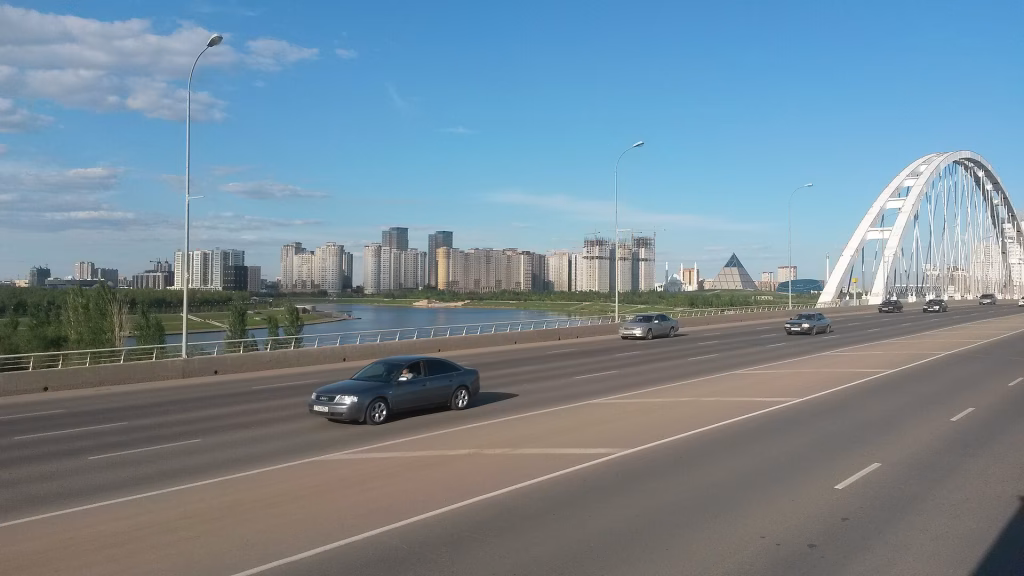 Astana skyline across the Ishim River with Peace Pyramid, Kazakhstan